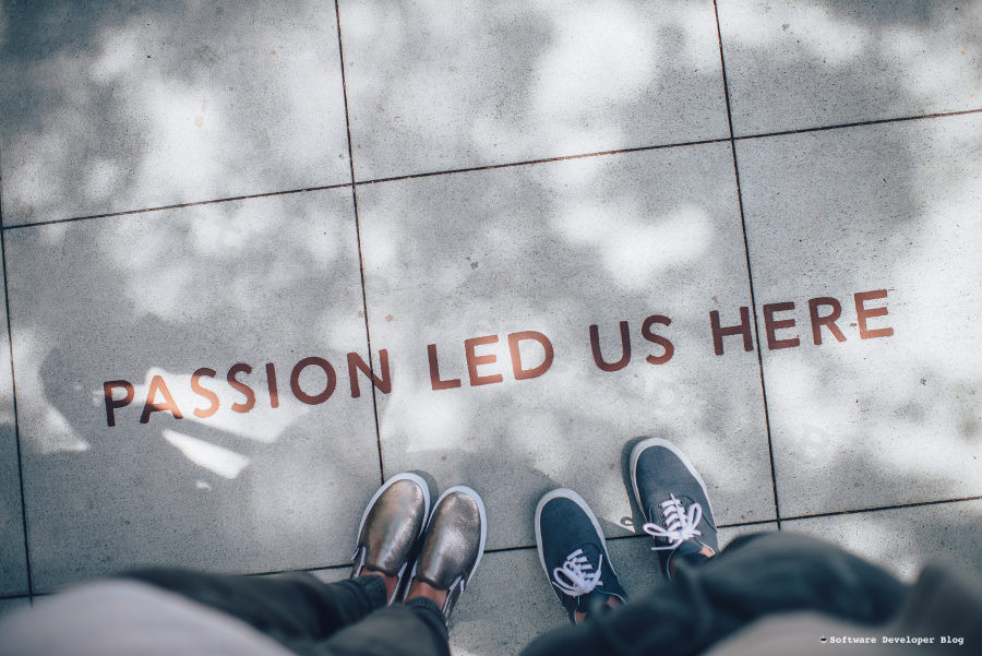 Two people standing on pavement with text 'Passion led us here'